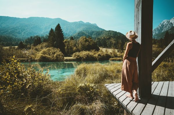 Woman enjoying freedom on nature outdoors. Travel Slovenia Europe.