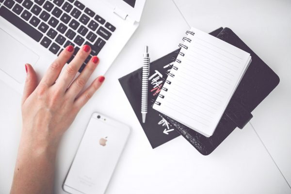 woman-hand-smartphone-desk-1.jpg