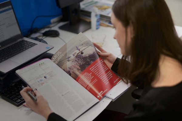 8020 Communications Team Members Reading Aviation Magazine Tinted